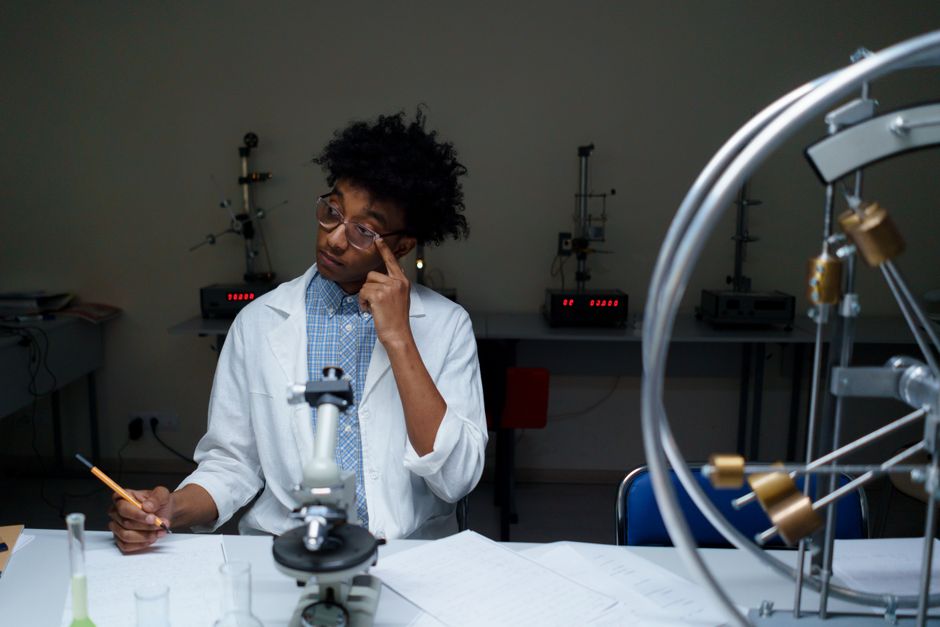 A young adult conducting scientific research in a modern laboratory setting.