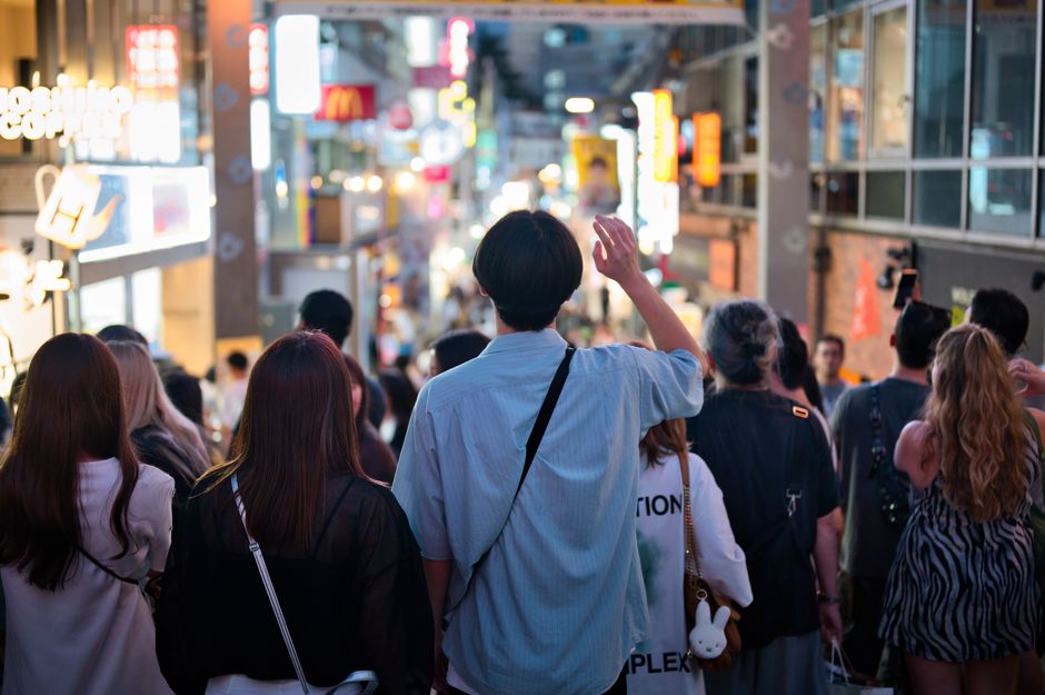 Vibrant night scene of a crowded street in Tokyo, Japan, capturing urban life.